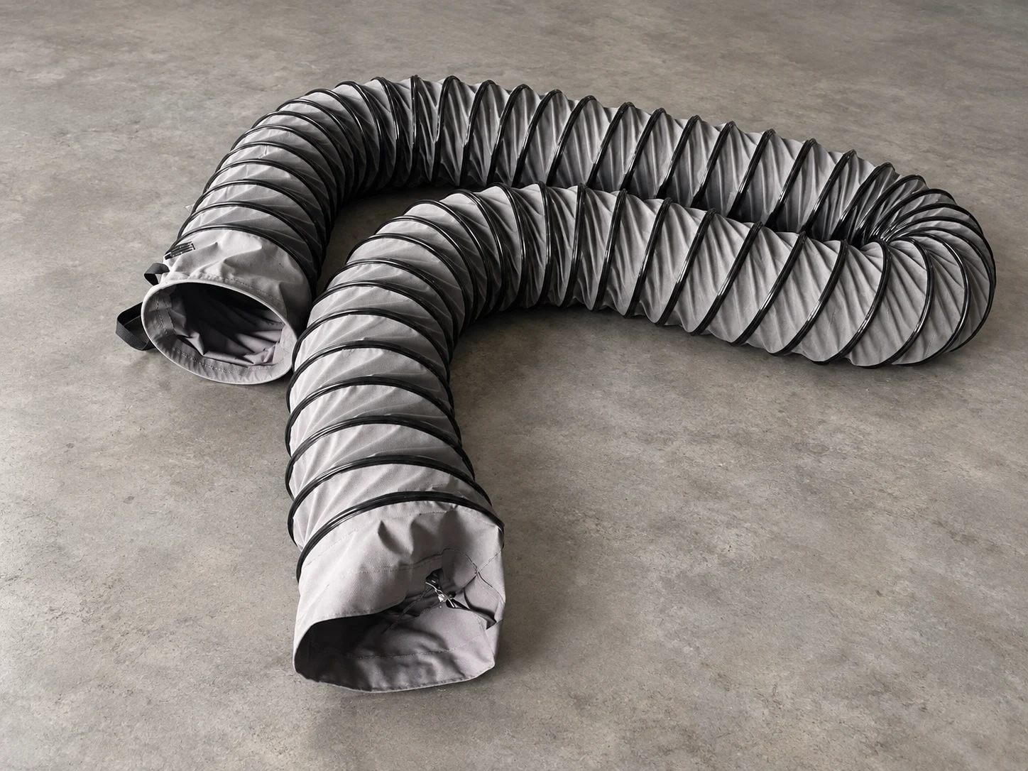 Retouched photograph of grey flexible ducts with spiral reinforcement